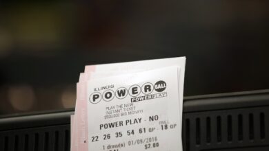 Powerball tickets rest on a 7-Eleven store register January 9, 2016 in Chicago, Illinois.
