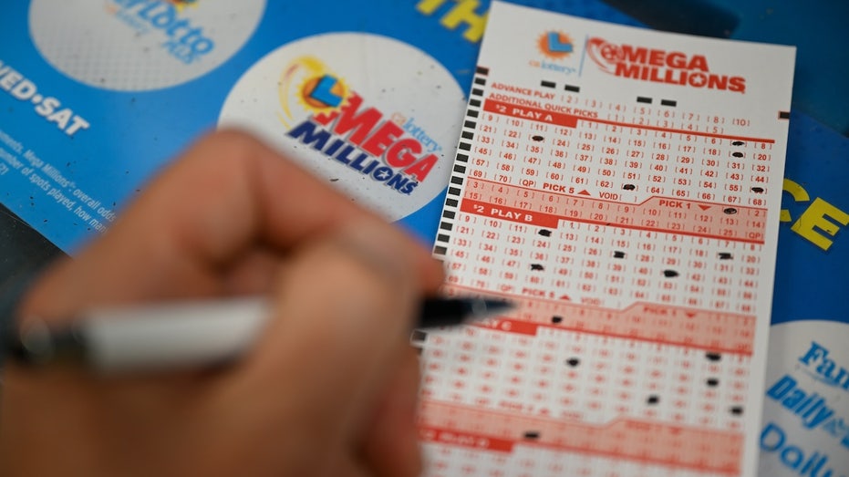 pen filling out lottery ticket numbers