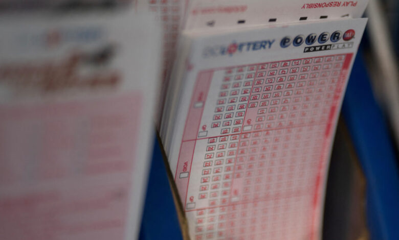 FILE PHOTO: Powerball tickets are seen at a liquor store, in Washington, U.S., July 19, 2023. Photo by Nathan Howard/Reuters