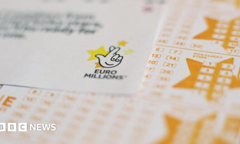 EuroMillions draw entry forms and ticket, which has yellow text and the EuroMillions fingers crossed logo in black.