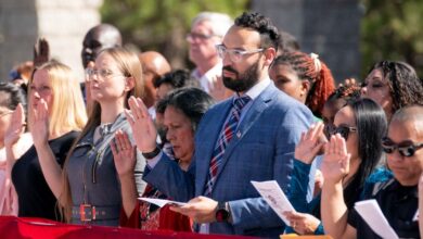 Immigrants take the oath of allegiance during a naturalization ceremony.