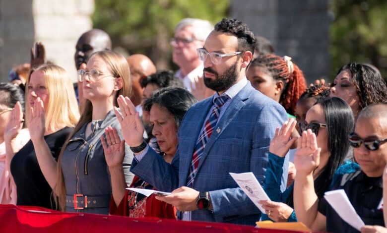 Immigrants take the oath of allegiance during a naturalization ceremony.