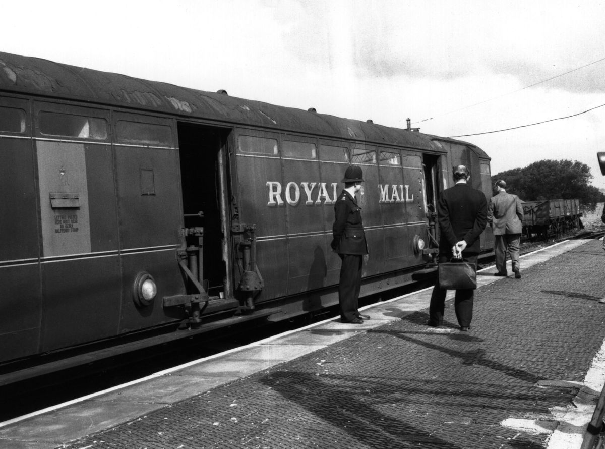 Investigators examining the Royal Mail train involved in the Great Train Robbery in 1963