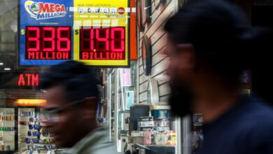 Sign shows the $1.4 billion jackpot in the Powerball lottery drawing in New York