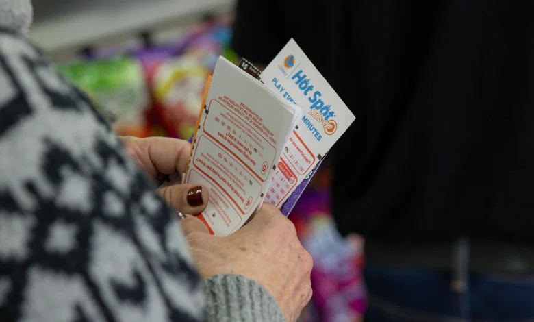 Hawthorne, CA - December 1: Ellen Adelman waits in line with her lottery tickets at Bluebird Liquor on Monday, Dec. 1, 2025 in Hawthorne, CA. Adelman and her husband William have been playing the lottery at Bluebird Liquor for years.  (Juliana Yamada / Los Angeles Times via Getty Images)