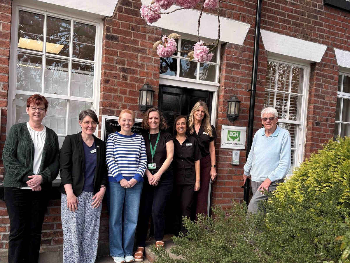 Bolton Guild of Hope staff thank Postcode Lottery players
