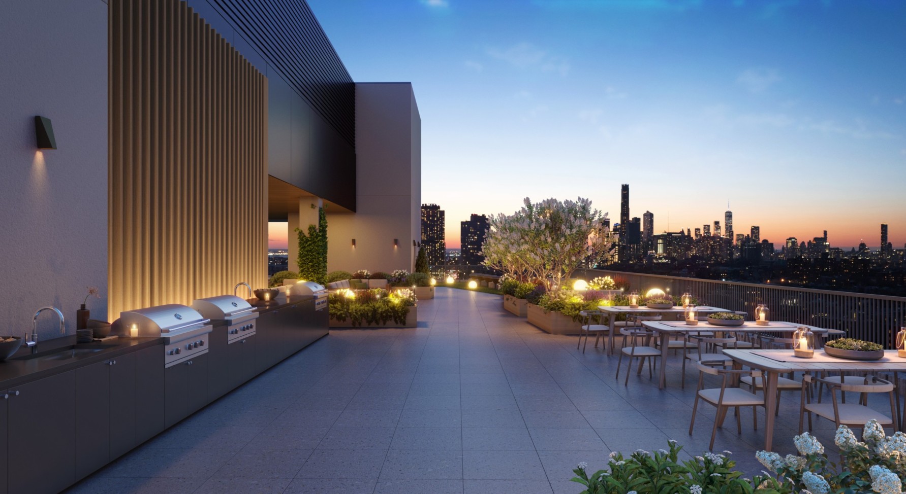 terrace at night with seating, outdoor kitchen