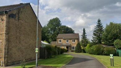 Residents on Oldham street celebrate after postcode win in lottery