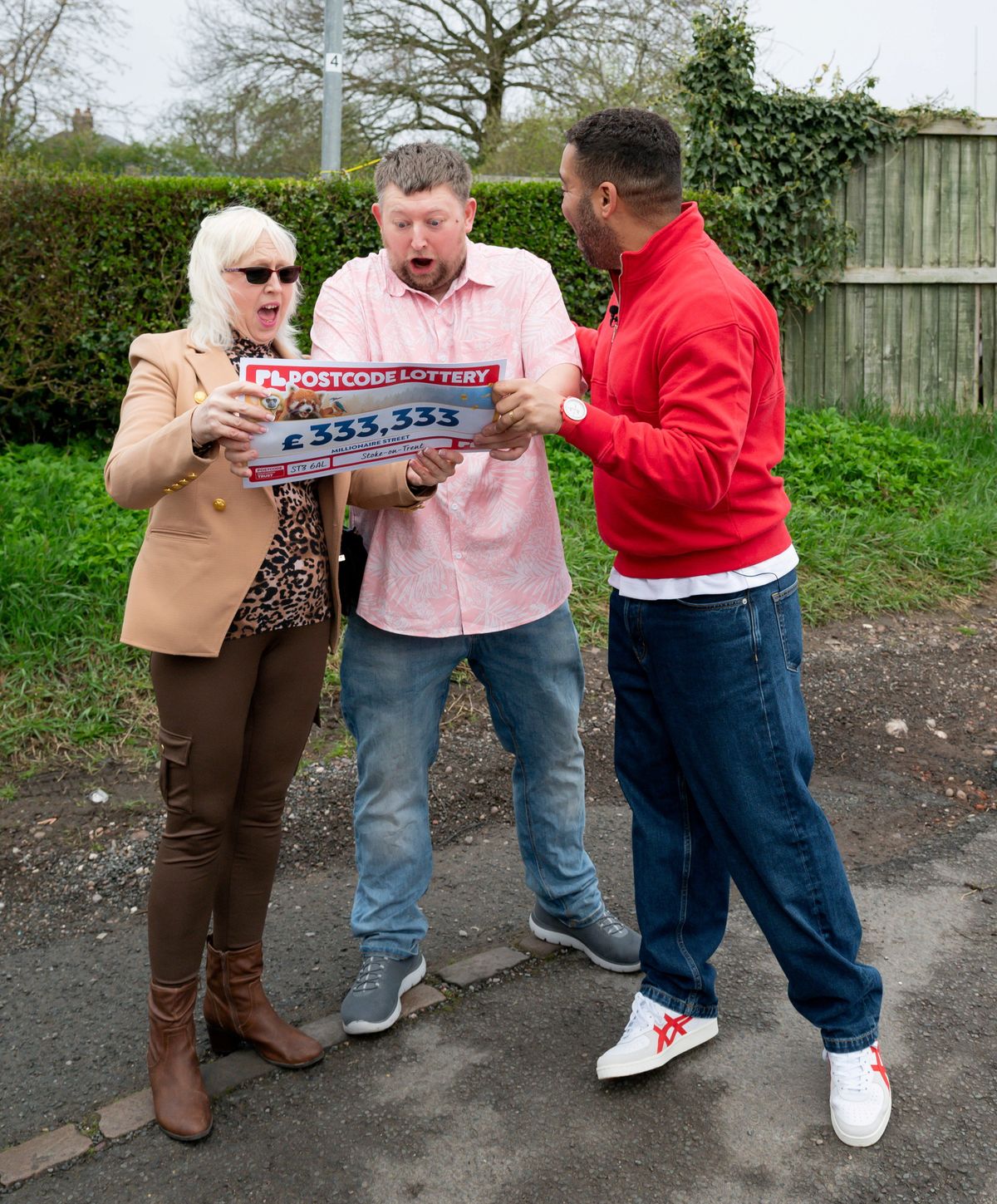 Lee Plant celebrates his postcode lottery prize with his mum Wendy