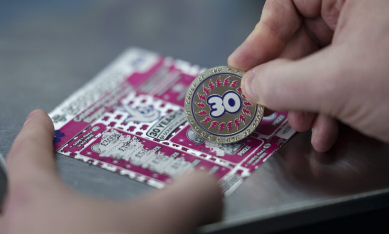 National Lottery retailers receive exclusive Scratch-Coins to mark 30 years