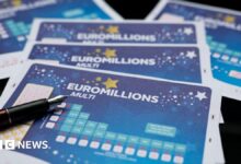 A Euromillions paper ticket with a pen on top.