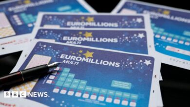A Euromillions paper ticket with a pen on top.