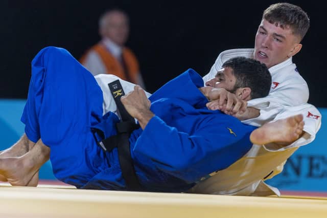Cupar judoka Finlay Allan (right) in competitive action, is one of the beneficiaries of a share in £210,000