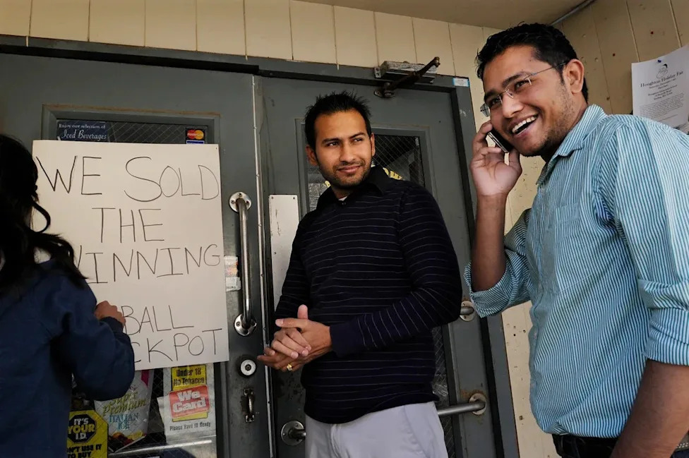 Chirag Patel, left, and his brother, Sanket Patel, right, celebrated another big win in 2013, after the store sold a $122 million Powerball jackpot