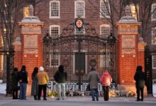 Visitors at a makeshift memorial for the victims of the Dec. 13 mass shooting at Brown University in Providence, R.I., in which two students, Ella Cook and Mukhammad Aziz Umurzokov, were killed. Umurzokov was an Uzbek immigrant.