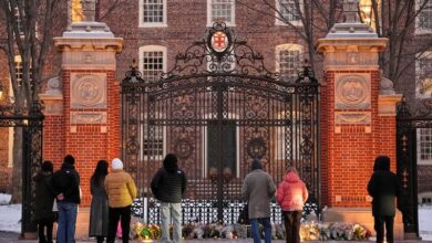Visitors at a makeshift memorial for the victims of the Dec. 13 mass shooting at Brown University in Providence, R.I., in which two students, Ella Cook and Mukhammad Aziz Umurzokov, were killed. Umurzokov was an Uzbek immigrant.
