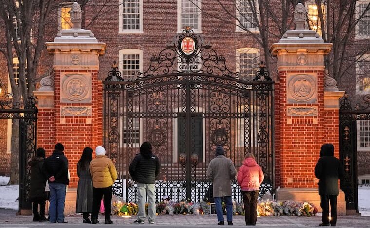 Visitors at a makeshift memorial for the victims of the Dec. 13 mass shooting at Brown University in Providence, R.I., in which two students, Ella Cook and Mukhammad Aziz Umurzokov, were killed. Umurzokov was an Uzbek immigrant.