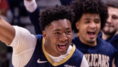 Dec 8, 2025; New Orleans, Louisiana, USA;  New Orleans Pelicans center Derik Queen (22) reacts to a play against the San Antonio Spurs during the second half at Smoothie King Center. Mandatory Credit: Stephen Lew-Imagn Images