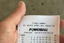 A Powerball ticket in someone's hand