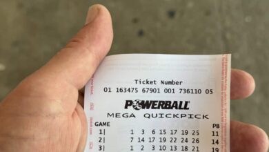 A Powerball ticket in someone's hand