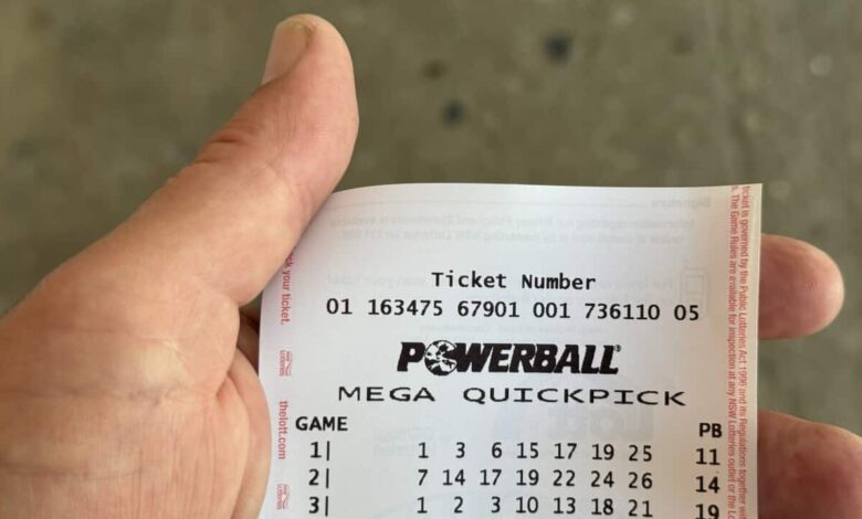 A Powerball ticket in someone's hand