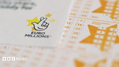 White and yellow Euromillions lottery slips seen stacked up