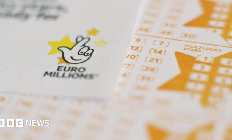 White and yellow Euromillions lottery slips seen stacked up
