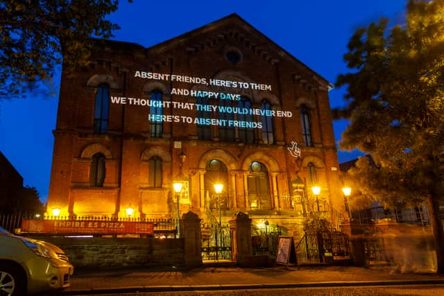 EDITORIAL USE ONLY

Allwyn Grassroots Projections 

Absent Friends Lyrics by The Divine Comedy, projected onto Belfast Empire Music Hall.

Picture date: Wednesday May 13, 2026. PA Photo. Photo credit should read: Liam McBurney/PA Media Assignments