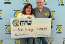 Michigan woman stops for pizza, wins record-setting lottery jackpot