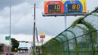 A billboard displays the estimated Powerball jackpot in Houston, Tuesday, Aug. 11, 2026. (AP Ph ...