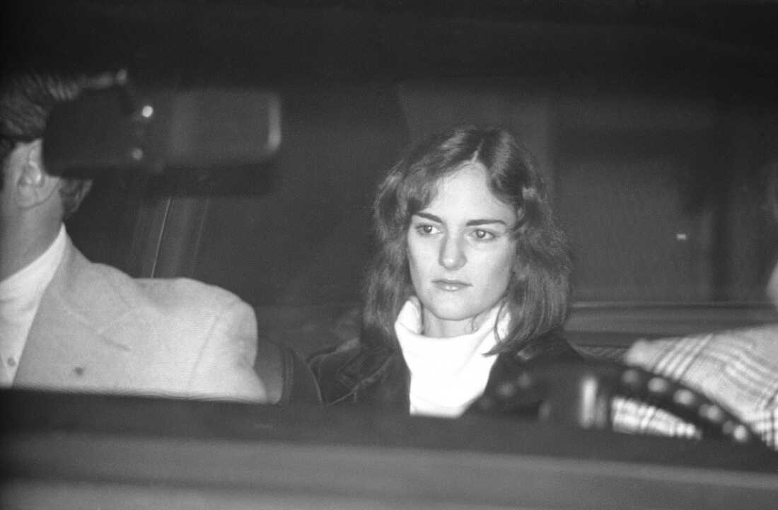 Patty Hearst is seated in a U.S. Marshal's car, leaving the Sam Mateo County jail in Redwood City, Calif., on Dec. 12, 1975, on her way to San Francisco to an appearance in federal court.