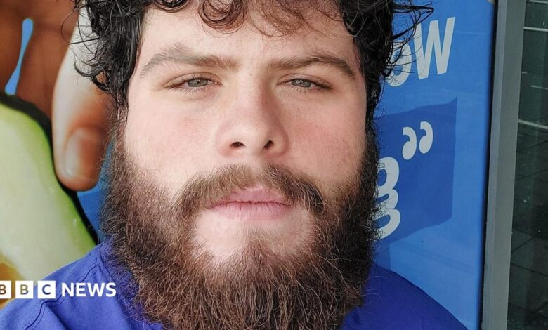 Photo of Jake Davison. He has curly dark hair and a brown bushy beard. He is looking into the camera.