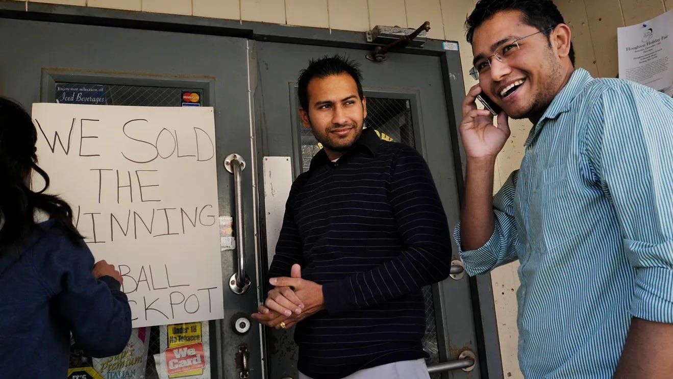 Chirag Patel, left, and his brother, Sanket Patel, right, celebrated another big win in 2013, after the store sold a $122 million Powerball jackpot
